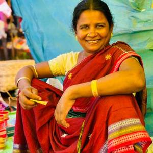 Smiling Indian woman in a red saree