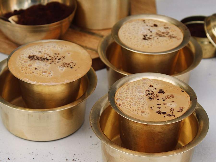 Brass davara and tumbler sets filled with frothy filter coffee