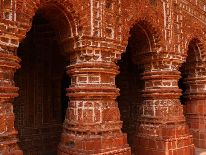 Carved terracotta pillars of a Bishnupur temple