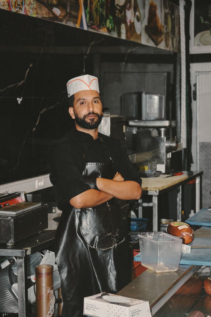 Chef Faraz Ansari standing confidently in the Dawat banquet kitchen