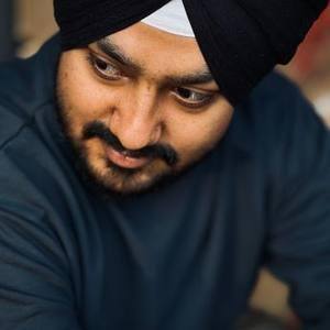 Smiling Sikh man in a black turban