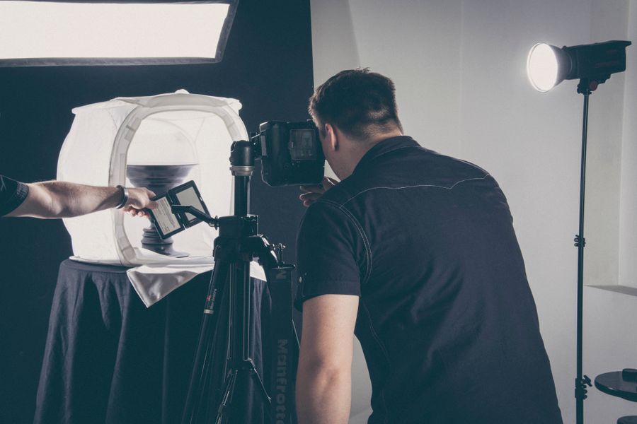 A product being photographed in a studio setup with professional lighting gear