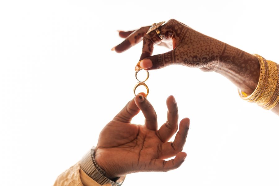 Bride and groom exchanging rings, photographed in close-up