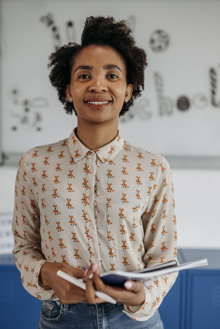 Nandini Rathore, Founder and Centre Head, smiling in a classroom
