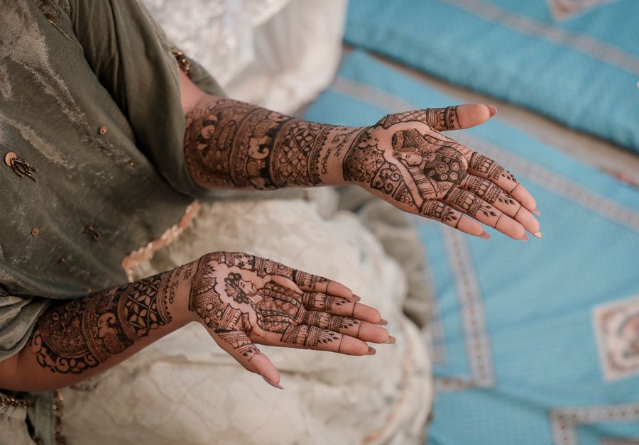 Intricate bridal mehndi on a client's hands