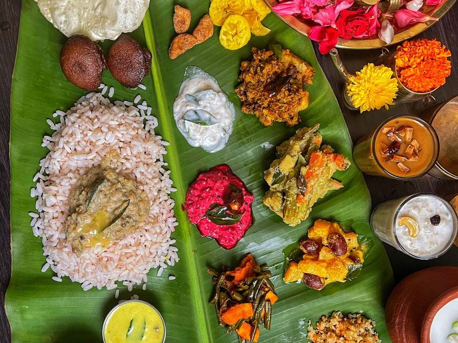 Colourful Kerala sadya feast laid out on a banana leaf
