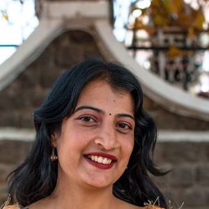 Smiling Indian woman with a bindi and open hair