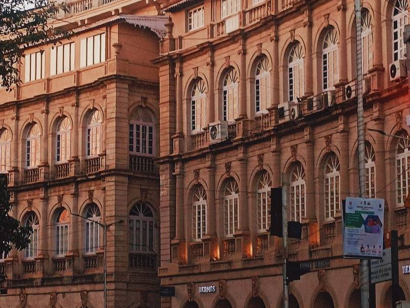 Heritage stone buildings on a street in Fort, Mumbai