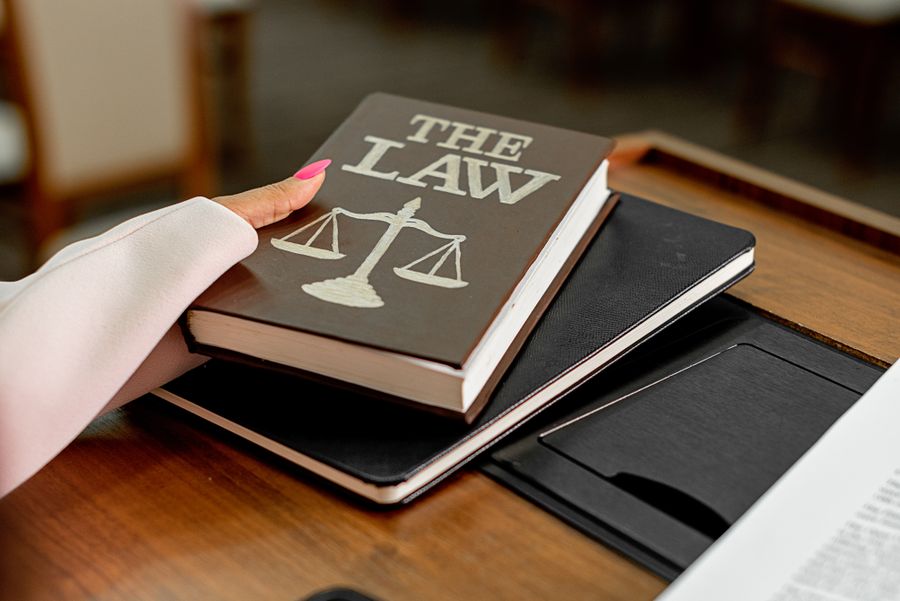 A law volume and the scales of justice on a reading desk