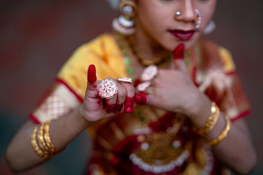 A Bharatanatyam dancer's hands adorned with traditional jewellery