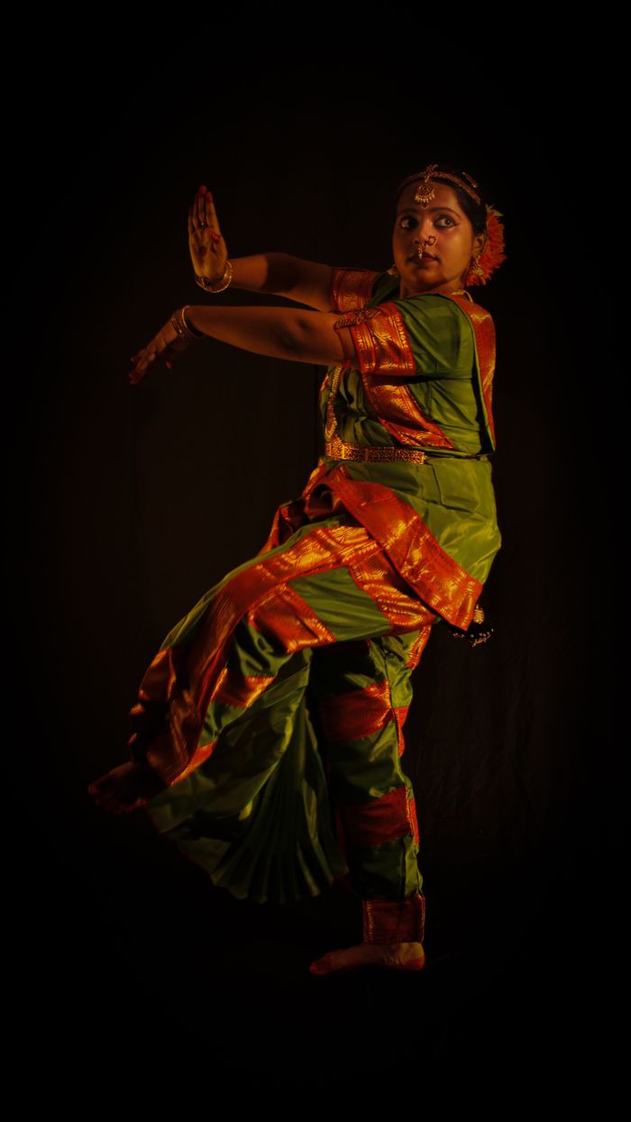 Guru Sharmila Chatterjee in classical dance costume, mid-pose