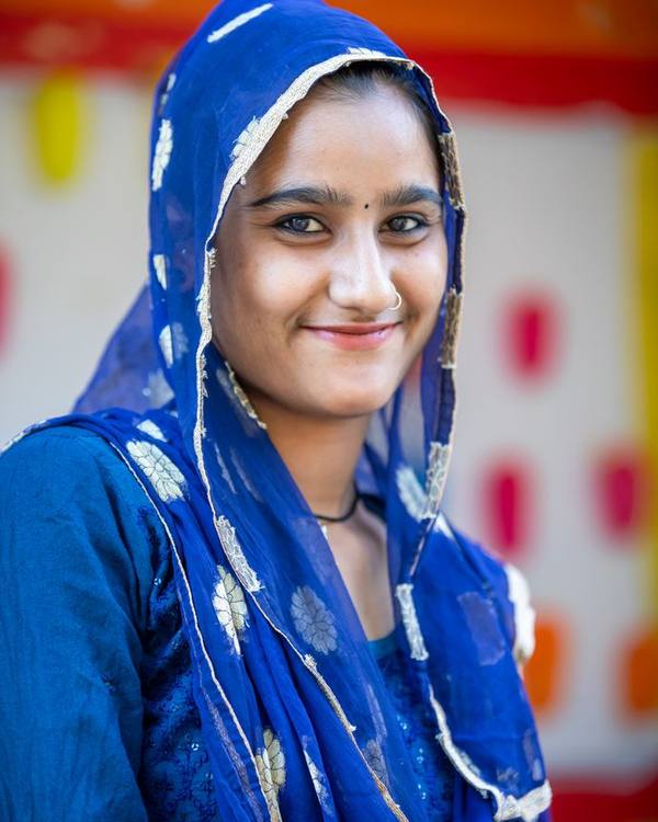 Smiling young Indian woman in a blue head scarf