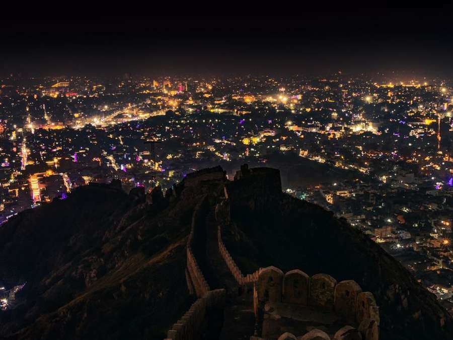 Jaipur's old city glittering at night, seen from a rooftop
