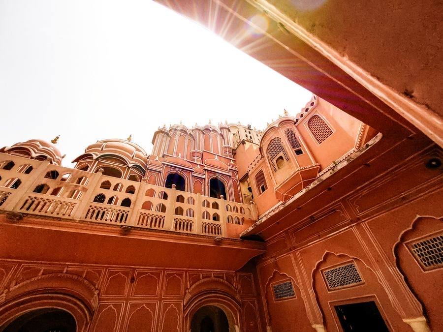 The pink facade of Hawa Mahal rising over Jaipur