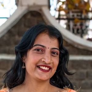 Smiling young Indian woman in a pink kurta