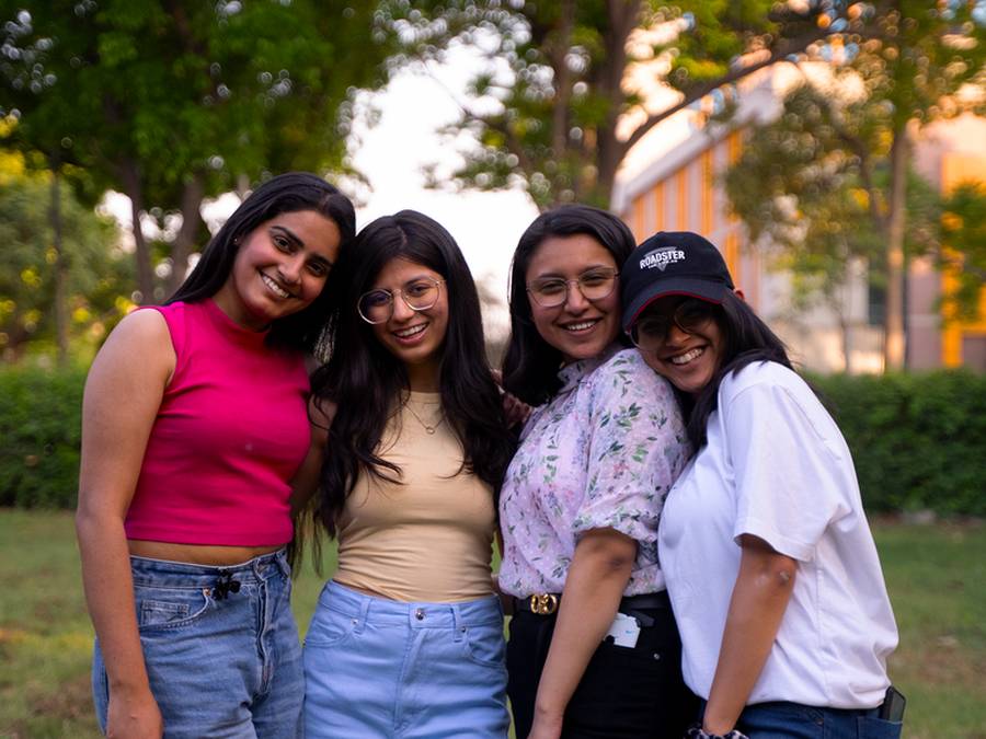 Group of Indian friends laughing together outdoors